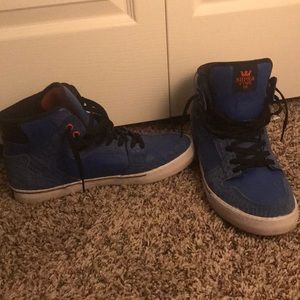 Blue and white Supra shoes
